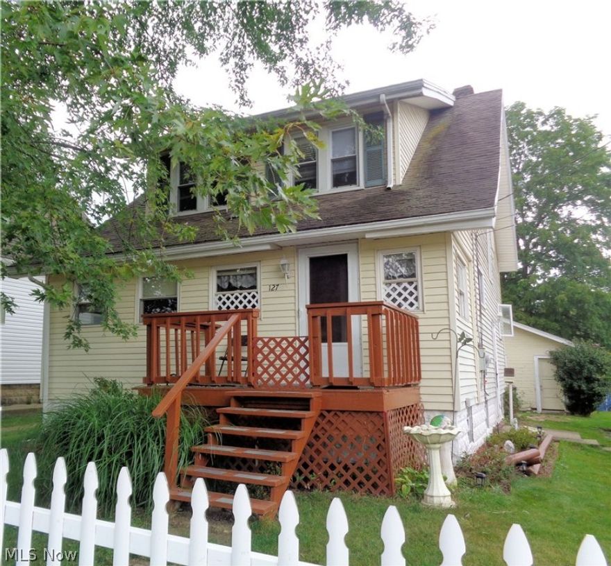 Spacious 3 bedroom 2 story. Updated eat-in kitchen with ceramic tile flooring and sliding glass doors opening to rear deck. Large formal dining room for all of your upcoming holiday gatherings with family and friends. Enclosed front porch. 3 large bedrooms with built-ins and hardwood floors. 2 car garage. Updates include furnace, plumbing, fixtures, paint, garage roof, deck.