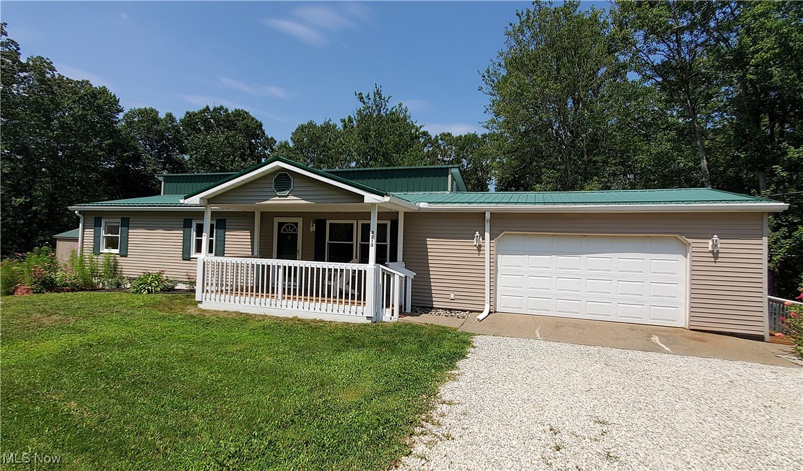 Updated and move-in ready, this spacious 2 BR, 2 BA home is nestled in a peaceful country setting just minutes from town. At the heart of the home is a beautifully updated kitchen, complete with a new dishwasher, and a spacious kitchen island—ideal for busy mornings or casual meals. The kitchen flows effortlessly into the dining area, where sliding glass doors open to a large two tier back deck overlooking serene wooded views—perfect for outdoor dining or relaxing.
Functionality meets convenience with a new washer and dryer discreetly tucked into a closet just off the kitchen.
The cozy living room features a large window and an electric fireplace. Down the hall, you'll find 2 spacious bedrooms, including a luxurious master suite complete with an attached sitting area, large closet, and a private en-suite bathroom featuring double sinks, a garden tub and separate shower.
The second full bath, located off the hallway, features a large walk-in shower for added convenience.
Additional highlights include a partial basement with a new furnace and hot water heater, a new A/C unit, new roof, 2 new windows in the second bedroom, oversized 1-car attached garage, covered front porch, large storage shed, and a beautiful yard perfect for a garden or outdoor play.
Don’t miss your chance to own this darling home that blends country charm with modern comfort - all while staying conveniently close to town!