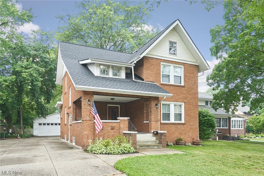 Location Location Location! Right in the heart of Cuyahoga Falls. This updated colonial still retains much of its original charm and character. New updated and spacious kitchen with granite counters, new roof and 4+ car garage make this a must see. Charming wood beams, tiled fireplace and built ins throughout. Newer windows, newer furnace, basement waterproofed.  You can sit and relax on the large front porch, enjoy the mornings from the master balcony and walk to all the downtown festivities. Call today to schedule your showing.