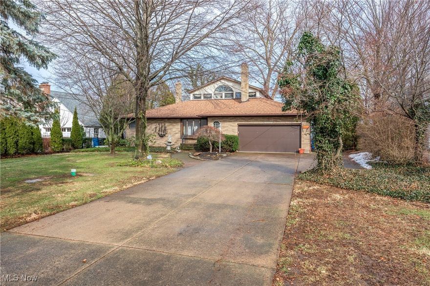 Unique Bay Village Lakefront with private stairs to lake access! Originally a brick ranch but current owners built two-story addition off the back of the property adding a large master and spacious great room with stone wood-burning fireplace, beamed ceiling, wet bar and window wall to lake views! An eat-in kitchen with electric cooktop, wall oven and slider to rear deck with lake views! Oversized living room with second stone, wood-burning fireplace flanked by built-in bookcases, cove ceiling and bay window to front! Both great room and living room are open to spacious dining room with built-in China cabinet and glass chandelier! Foyer with coat closet! Some original wood flooring and newer LTV! Two decent-sized bedrooms on main floor with original hardwood flooring and full bath! Open staircase leads up to a second floor, owners suite with spacious bedroom and sitting area, window wall, slider to balcony and the third, stone fireplace! Oversized bath with double vanity, jetted tub, shower stall and walk-in closet! Paladium window! Full basement under the original home (half bath currently not working) Small area is finished with unique glass block wet bar and the fourth, wood-burning fireplace! Half bath off garage entry into kitchen! Two-car attached garage with access to attic storage! Rear yard has a large deck and stairs to the water! Needs work and TLC but open layout with lovely lake views...