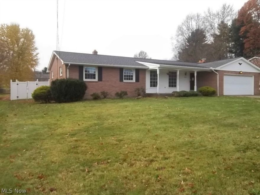 NEWER BRICK RANCH in need of some cosmetics.  Sun room opens to private fenced in back yard.  Possible rec room in partially finished basement with bar & woodburner.  Newer windows, glass block & work bench in basement.  Newer furnace, updated electric.  Sewers in front of the street but property is not connected.
