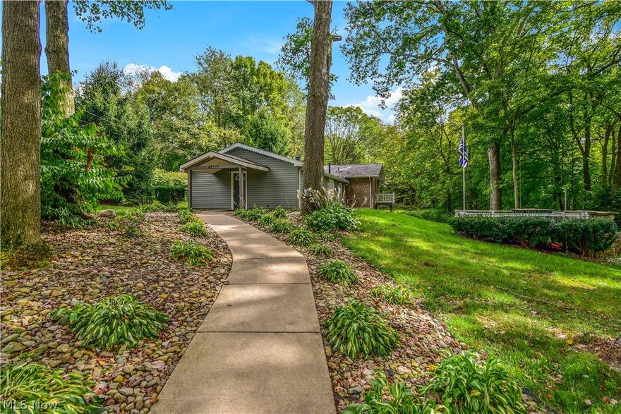 Awesome 3 bed/3 bath Updated Home offers an Incredible Scenic & Private Backyard.   Home offers an Awesome Open Floor Plan a Huge Family Room, First Floor Master Bedroom & Master Bath, & First Floor Laundry Room with 2nd Full Bath.   Lower Level offers a Huge Great Room with Cathedral Ceilings & French Doors to a concrete patio overlooking the property. This home is heated with natural gas and a wood burner stove that will keep utility money in your pocket. Situated in Beaver Local School District this home sits close to shopping plaza but yet hidden away from the busy hustle and bustle in a quiet neighborhood with low traffic. This home is truly move in ready and priced to sell!!  Home has a New Roof & New Vinyl Siding!