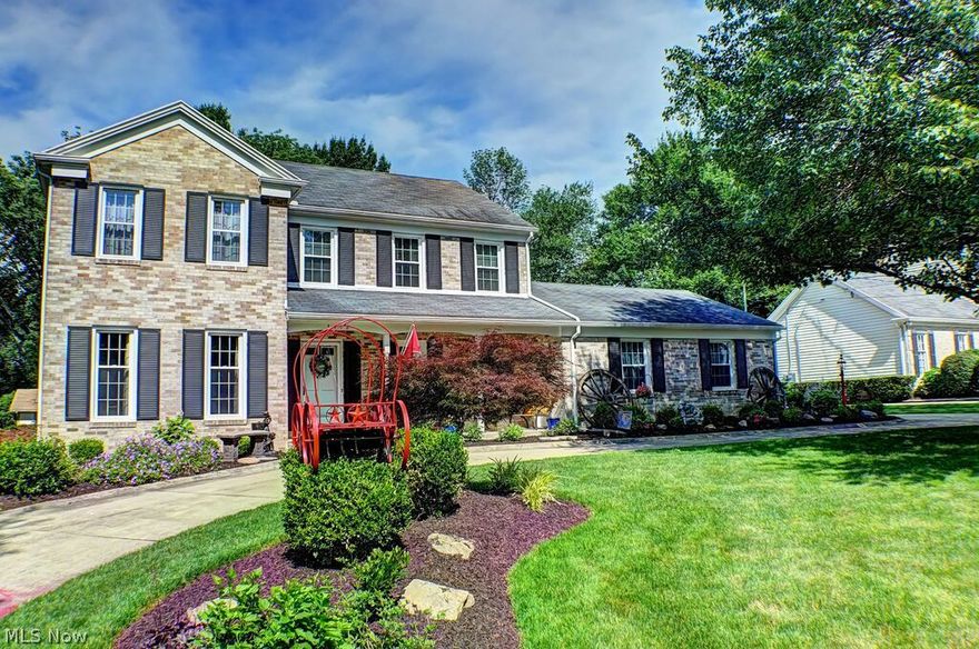 A Hamlin Built Classic, this home is in the heart of Fairlawn.  Meticulously maintained and updated! The living room has hardwood flooring, crown molding and glass pocket doors. The spacious dining room has hardwood flooring, crown molding, & blt-in corner cupboard. The first floor family room has wood flrs, gas fireplace and leads to the 3 season sunroom and newer patio. The kitchen features quality, cherry cabinetry, tile floors, dorian counters, a generous eating area, a closet pantry and a door leading to the patio.   The hardwood floors throughout are beautiful!  The second floor features a Master Suite with generous closets and 3 other sizable bedrooms.  All closet systems stay. There is a walk up attic for additional storage.  Newer windows throughout. Beautiful contemporary finished lower level offers two large spaces, a full bath, a laundry room and a mechanical room.  Freshly landscaped, circular driveway and generous rear-load,  2 car, garage with cold water, a drain and ple