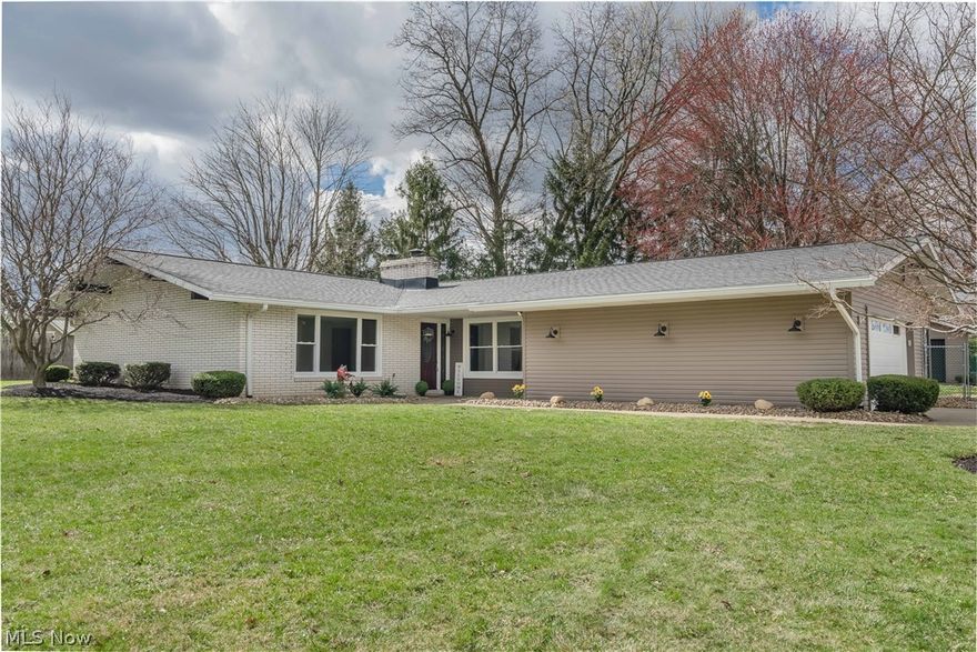 Welcome to this beautifully remodeled ranch style house in the sought-after Jackson Township with Jackson Local Schools. Arriving is a treat, as you have wonderful curb appeal, and a unique position on the lot, offering extra privacy. Upon entering you will instantly appreciate the abundance of natural light, with brand new flooring throughout. Equipt with two living space, you have the ability to have a more formal and/or casual sitting and entertain spaces. The second family room offers a beautiful stone gas fireplace with new gas logs, and a fresh makeover. The kitchen is a real gem, with brand new cabinets and countertops, light fixtures, and more! Convenient eat in bar present. Formal dining room. First floor laundry room is perfect for ones seeking true one floor living.  Offering three (or even four) bedrooms and three and a half bathrooms, this move-in ready home is a showstopper. All three bedrooms are generously sized. The finished lower level adds a bonus 4th bedroom, a third full bath, and additional living space. Perfect for those wanting to utilize and capitalize on all finished space. Outside, enjoy a half-acre plus lot with new landscaping, a concrete driveway, an attached two-car garage plus a detached one-car garage - offering three garages total, and a fenced area. Don’t forget the serene three-season enclosed porch—perfect for relaxing. Every detail was thoughtfully crafted—just move right in! You will not want to miss your chance on this Jewel in Jackson. Call today for your private showing. Open House Sunday, March 15th from 2pm - 4pm.