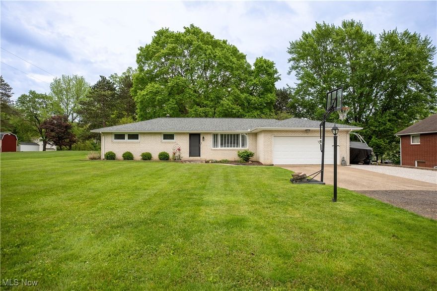 Welcome to the perfect brick ranch nestled in desirable Jackson Local School district! Upon entering through the front door, you'll find a large inviting living room with lots of natural light. Next is the formal dining room that looks out to the lush backyard. The kitchen is fully equipped and situated next to the family room, which has a cozy gas fireplace. The patio doors lead out to the deck and cute brick patio- great for enjoying a cup of coffee in the morning. The main floor also features 3 bedrooms, full bathroom and a half bathroom. Downstairs is an awesome finished entertaining area with a built-in bar, space for your pool table, and a carpeted tv area with your second fireplace that is wood burning. The home features an attached 2 car garage and additional parking for your weekend boat or ATV. You have to see this well maintained and move-in ready home for yourself! Call today for your private showing!