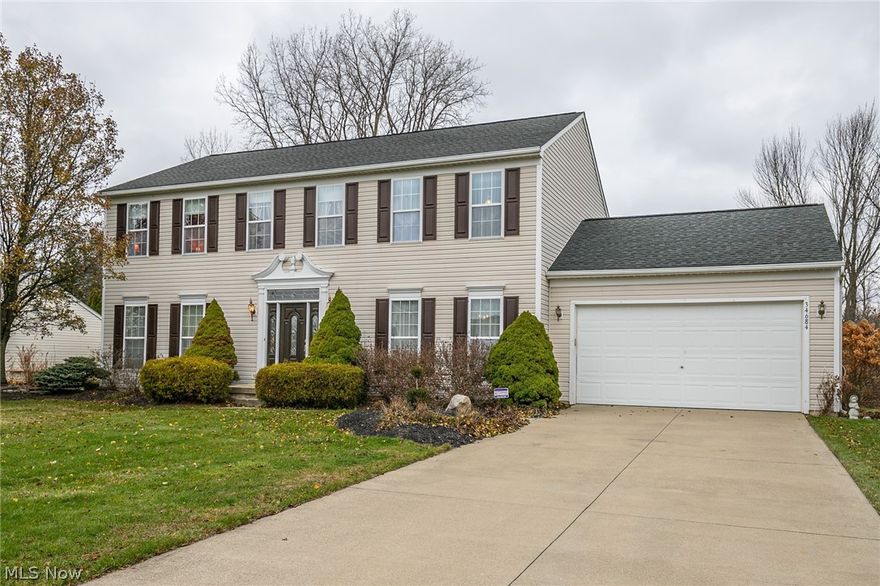 Welcome home to your beautiful Yorkshire model home located in Butternut Grove in North Ridgeville.  This 4 bedroom 2 1/2 bath colonial offers a timeless floor plan and open concept from the eat-in kitchen through the family room.  The chef in your family will love the updated kitchen, which includes, granite countertops, range, refrigerator and dishwasher.  New flooring runs from the foyer through the kitchen and living room.  Upstairs you will find the huge master bedroom with crown moulding and 3 other good sized bedrooms.  Enjoy the evenings from your wood deck overlooking the large wooded backyard.  The roof, A/C unit are only 7 years old and the hot water tank is just 2 years old.  A 1 year home warranty is included for your peace of mind.  Conveniently located close to I-480 and the turnpike.  Call for your private showing today.