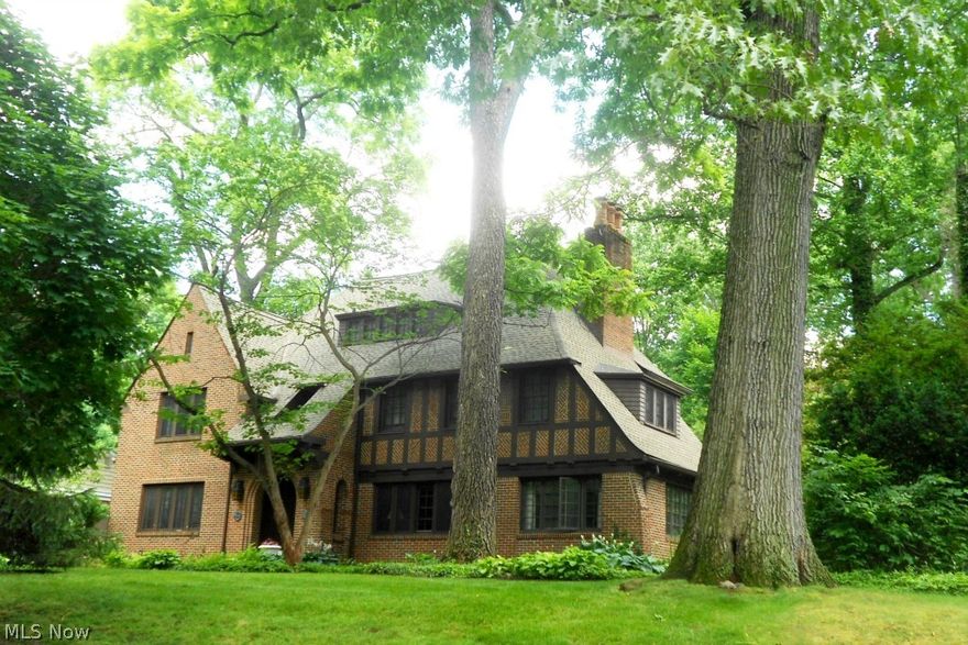 SWIM, FISH & SAIL IN SILVER LAKE!  A true gem full of charm & character!  Exceptional and well loved 5 bdrm, 4.5 bath Tudor w/Lake Privileges!  Impressive attention has been paid to preserve the authentic vintage detail of this home offering gorgeous woodwork - hardwood floors, trim & baseboards, crown molding plus 8 panel wood doors.  There are 2 sets of French doors off the living room, one to the lovely sun room & the other to the beautiful library with wood burning fireplace.  A second wood burning fireplace & built-ins accent the living room.  Both the sun room & the library have stone flooring & sliders to the patio & private backyard oasis.  The bright kitchen features a butler’s pantry, walk-in pantry, corian counter tops, ceramic tile flooring & stainless steel appliances.  A separate staircase leads to the 3rd floor bedroom, sitting area & bath.  On the 2nd floor, find a spacious master with 2 walk-in closets, bath & sitting area (8 X 10).  French doors off the master open to