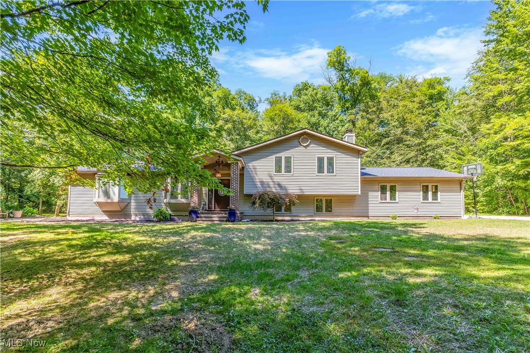 Kenston Schools & Geauga County! Up a Long Leafy Drive This Comfortable 4 Bedroom, 3 Full Bath Home Is Sited on 5 Acres of Wooded Privacy. A New Front Door Welcomes You to the Living Room and the Light Filled Home Beyond. The Spacious First Floor sports a Large Eat In Kitchen with Custom Cabinetry, Living Room, A Dining Area/Sunroom Surrounded by Windows, and a Spacious Master Suite with Vaulted Ceiling, Jetted Tub/Shower, and a large Walk-in Closet. Upstairs, 3 Spacious Bedrooms, one with a Balcony, all share an Updated Full Bath. In the Lower Level, the Mudroom and Family Room with Fireplace have all New Flooring, Walls, Paint. A 3rd Full Bath is right off the Mudroom for your convenient use! The Extra Large 1078 sq ft Basement holds the Laundry and plenty of Dry Space for a Rec Room, Bonus Rooms, Storage or Offices. Outdoors, a Paver Patio is Partially Covered by a Metal Roofed Gazebo and the Enjoyment of Bird Watching or Gathering Around the Fire Pit. A Shed off the Driveway offers plenty of room for equipment storage or as in the case of this homeowner, a Workout Space. New Roof 2024. Home Waterproofed 2025. Conveniently located Near Shopping, Restaurants and Major Roads. Don't Miss This Nice Opportunity in Kenston Schools! An Added Bonus: Through your Woods, this Property goes straight back into Beartown Lakes, Geauga Park District, with paved trails, fishing lakes, picnicing and wintertime sledding! Seller concessions negotiable.