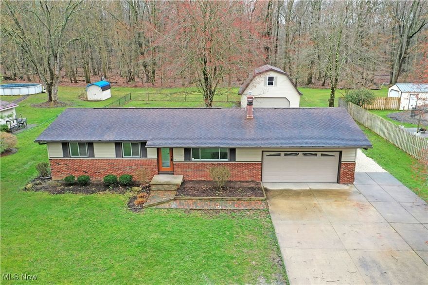 Don’t hesitate, this one won’t be here for long! Freshly renovated from top to bottom and move-in-ready, this highly desirable Vienna ranch is here to take your breath away with its gorgeous looks and thoughtful updates. Tucked away in a quiet neighborhood, the home is quick to showcase its handsome brick accents and an outstretched concrete driveway leading to a huge barn for additional parking and shop-space alike. Above, the finished second story makes for an excellent workshop or man-cave alike. Adding to the allure, a fenced-in backyard makes an easy choice for pets and families. Through the decorative front door, an inviting living room presents you with a striking black mantle with a gas fireplace as sunlight filters through the picture window. Hardwood styled floors pair wonderfully with the light-colored walls and white trim. Around the corner, illustrious dining space takes advantage of backyard views as you revel in the stunning kitchen, complete with polished stone countertops and modern stainless appliances. Down the main hall, a remarkable full bath accompanies the trio of bright and spacious bedrooms to complete the floor. Down below, the finished basement includes plenty of rec space along with a second updated bath. Laundry and storage are hidden away nearby.