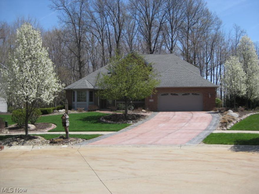 Better than new, custom built center hall colonial. The first floor offers a master bedroom with a glamour bath  that includes a tub and separate shower stall. A formal dining room with coved ceiling. The great room offers high ceilings and a gas fireplace. The large eat-in kitchen is beautiful featuring loads of cabinets and an island. There is a bonus/family room with a Franklin stove and this room leads to the professionally landscaped yard. There is also a half bath and laundry on the first floor. The second floor offers 2 bedrooms, a full bath and a loft over looking the great room that could be easily converted to a fourth bedroom. The 1771 sq foot basement is a walkout to the outdoor entertainment area. The very private wooded yard backs up to Calvin Park and features a large custom patio with a gazebo. If you like to entertain or just want a private back yard, this is the home for you!