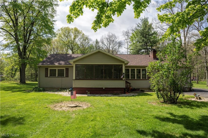 Welcome to this beautifully updated and well maintained property located on 3 spacious acres in a quiet neighborhood. You will walk in to a large sunroom/foyer where you can enjoy a morning cup of coffee to start your day. Upon entering, you are greeted by open concept living area with plenty of natural light. The main level features luxury vinyl floors throughout (2018)and a cozy fireplace. From there you will enter the updated kitchen. Also on the main level you will find the large laundry room, 3 bedrooms and 2 fully updated baths. This flowing floorplan provides the perfect space for entertaining family and friends. Additional highlights include a 4 season sunroom off the kitchen and a deck that overlooks your beautiful, private back yard. This house has been renovated from top to bottom all you have to do is move in. Other updates include, a new roof (2025), Furnace/AC (2022) and Hot water tank (2017). This home is move in ready, offering plenty of charm. Contact your favorite real estate agent for a showing and make this your next home for many years to come!!