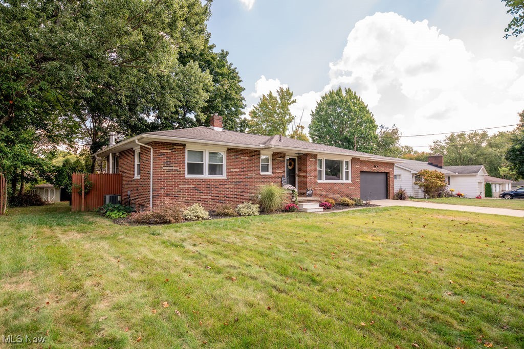 Home Sweet Home Awaits You! Welcome to this beautifully updated Tallmadge all brick ranch. Look no further, this is the well loved and cared for home you've been waiting for! Inside you'll find 3 bedrooms, with the possibility of a fourth in the basement, 2 full baths, hardwood floors, stainless steel appliances, granite counters, updated decor and finishings. If that's not already enough, a three seasons room perfect for entertaining. A slider leading from the kitchen to the patio ideal for grilling out, or a night under the stars soaking away the days worries in the hot tub. The fenced in yard offers peace of mind when the kids or pets are out playing. With the smaller rails in the bottom of the fence to keep even the best escape artist from slipping out. Beyond the fence even more backyard space to spread out with a shed for those seasonal items to keep them stowed away. Improvements included though not limited to: kitchen appliances, kitchen sink, light fixtures inside & out, windows, flooring, fencing, electric, kitchen, baths, HWT, A/C, Roof. To top it off sellers are offering not one but a TWO-year Home Warranty for the buyer's peace of mind. Don't wait, call today for your showing, you won't want to let this one go!