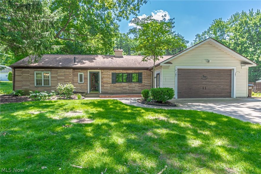 You won't believe your luck when you move into this beautiful ranch home. Perfect for first time home buyers all the way to those looking to downsize. Complete with a new septic system 2021, furnace 2021 and fresh paint 2022 you won't have to think about much. Move right in and begin enjoying your lovely home inside and out. Engineered hardwood floors throughout most of the home add a cohesive flow. The updated kitchen has handsome, high-end, soft close cabinetry with granite counters and stainless steal appliances. The large window looks out on to your welcoming front porch. Snuggle up by the fireplace on chilly evenings and on those warm days and nights, the 1.15 acre backyard and deck with hot tub, perfect for entertaining. The heated garage has loads of space with a work bench and sink! This home won't last long, schedule your showing today!