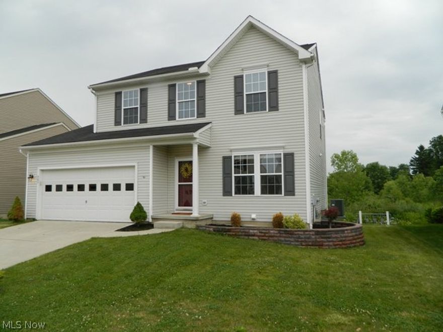 This incredible, newer home in Kent features over 2600 sq ft of finished space (including the basement).  The first floor features a tiled entry and bath, 9ft ceilings, dining room, large kitchen open to the living room and adjoined by a breakfast room w/ vaulted ceiling.  Kitchen features a full set of appliances including a new, French door fridge, pull-out faucet, can lighting, wood floors, center island, tall cabinetry and pull out drawers in the base cabinetry.  The 2nd level features the 3 bedrooms, full bath and a common area, great for play area, computer, etc.  The large master suite features a walk-in closet and an adjoining bath with dual-sink vanity.  The basement features 600 sq ft of finished space and a 3rd full bathroom!  The home has can lighting, wood flooring, ceramic tile, 9ft ceilings, updated interior & exterior lighting, concrete driveway, 2-car garage, 6-panel doors, large vinyl windows w/ grids, a high efficiency furnace and more!