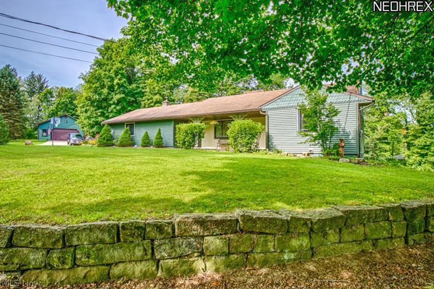 1 Year Home Warranty Included on this Great Investment!! Enjoy the special featurs spacious three bedrooms, three full bathrooms, and three fireplaces, all in a park-like setting. Each day when you sit at the kitchen table, no matter the time, you experience breathtaking views of the water and the woods behind it. Also, let's not forget the finished basement with a built-in stove and wet bar that opens into an enclosed patio walk over the bridge and enclosed pavilion with a fireplace. This is an outdoor lover's dream on a nearly six acre park-like setting, overlooking your own lake and creek. You see deer, beavers, turkey and lots of waterfowl. Truly paradise.  Throughout the home are hardwood floors. The master bedroom has a three-way viewing long mirror, custom made walk-in closets with built-in cedar lined boxes for sweaters, wooden shoe racks, build-in dresser, and more. Across the cement driveway is a 32x64 outdoor building built to last. Welcome Home to a Life style you will Cher