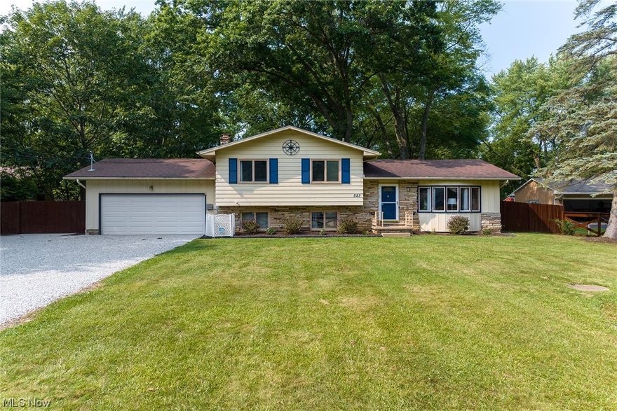 Updated and well maintained open floor plan home with a one of a kind, huge 4 car, heated, lofted workshop!  The house offers great sight lines from the moment you enter the front door. Main floor with vaulted ceilings and a spacious sunken living room that opens to the dining room and updated kitchen.  Kitchen offers stainless appliances and plenty of counter space, updated lighting, modern neutral colors and new flooring.  Sliders out to the expansive private back yard with a paver patio and fire pit.  In the lower level you'll find a spacious renovated half bath and family room with wood burning fireplace (can easily be converted back to gas).  Laundry and storage as well as steps to the attached 2 car garage complete the lower level. Upstairs offers 3 bright and sunny bedrooms and a gorgeous remodeled full bath.  This property stands out from the rest with the additional 24X40 4 car heated outbuilding with loft storage. Outbuilding with its own 100amp electrical service, ethernet a