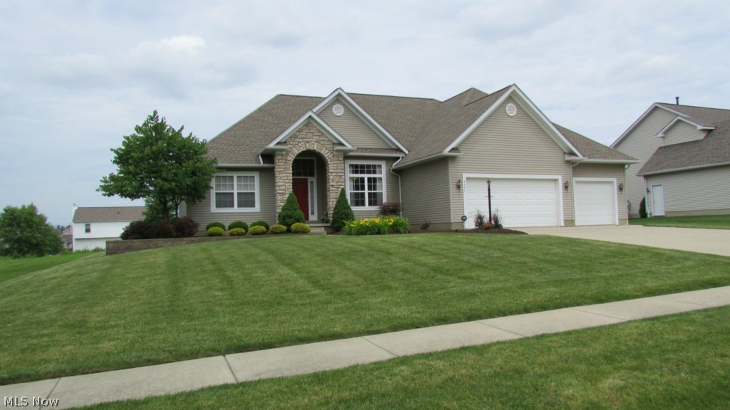 Welcome to this remarkable ranch, with stone accents and plenty of upgrades, in The Reserve. The home is nestled in an area of custom homes in the Harvest Hills development of Rootstown! This home has 3 bedrooms, 2 full baths, & first floor laundry on the main floor of 2068 SF! Immaculate neutral tasteful decor full of upgrades, 630+ SF of finished basement, including recreation room and office with enormous amount of storage. This sums up to the 2700SF of finished living area listed above. With a large open foyer, formal dining room and eat in kitchen with stainless appliances leads to the awesome back patio.Very private Paver-stone back patio, with very clean crisp mature landscaping. Master bedroom boasts vaulted ceiling, large master bathroom suite with large walk in closet, garden tub, and separate stand up shower. More than enough room for vehicles and such with a 3 car garage. This home is a must see!