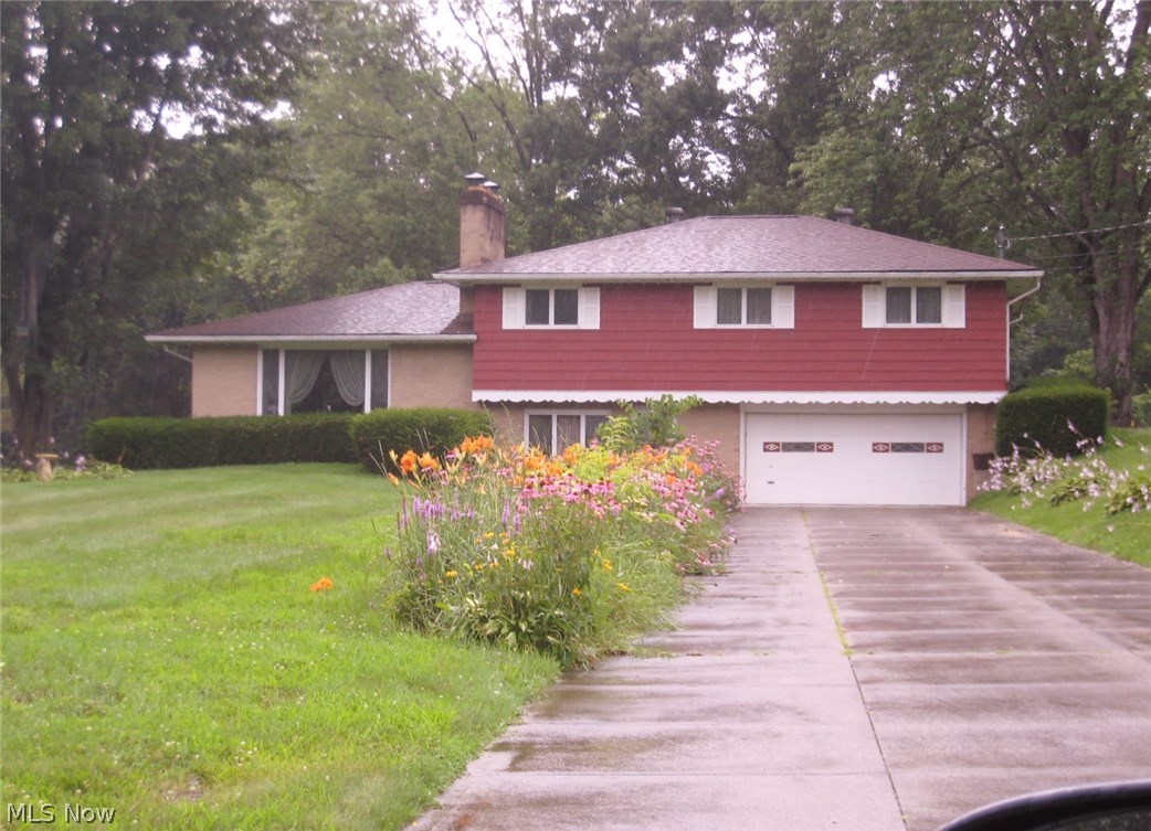 This lovely large 4 level split home sets on a 1.21 acre lot in a lovely, quite neighborhood and backs up to woods. This pristine home has 4 bedrooms and 2 and a half baths. The large entrance room that could be an office, 1st floor. laundry, and 1/2 bath. Large master bedroom, walk-in closet, shower, bath and 3 additional bedrooms and full bath. The home offers hardwood floors in main area living room with fireplace, dining area off kitchen and door to deck and back yard. Lower level is totally finished with bar and sink, fireplace. Updates include baths, kitchen, well pump, 2014, roof 5 years. Septic replaced 8/15. Home warranty and one car detached garage.