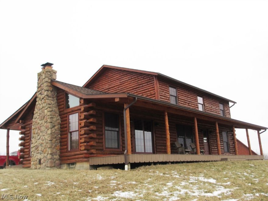 Exceptional log cabin home situated on 46.96 acres. 10 minutes from Cadiz, 20 minutes from Tappan Lake and borders Harrison State Forest at rear. Ideal hunting/recreational get-a-way property with loads of wildlife and seclusion. Front and rear covered porches with Trex decking, knotty pine floors, ceilings and wood work throughout, open kitchen design for entertaining. Huge family room with vaulted ceilings and stone fireplace. Detached 34x50 pole building with concrete and water. Major updates include: 2 bathrooms, wood flooring, windows, light fixtures, HVAC, well pump, front and rear porches, shingles, cement and water in building. Major money has been spent.