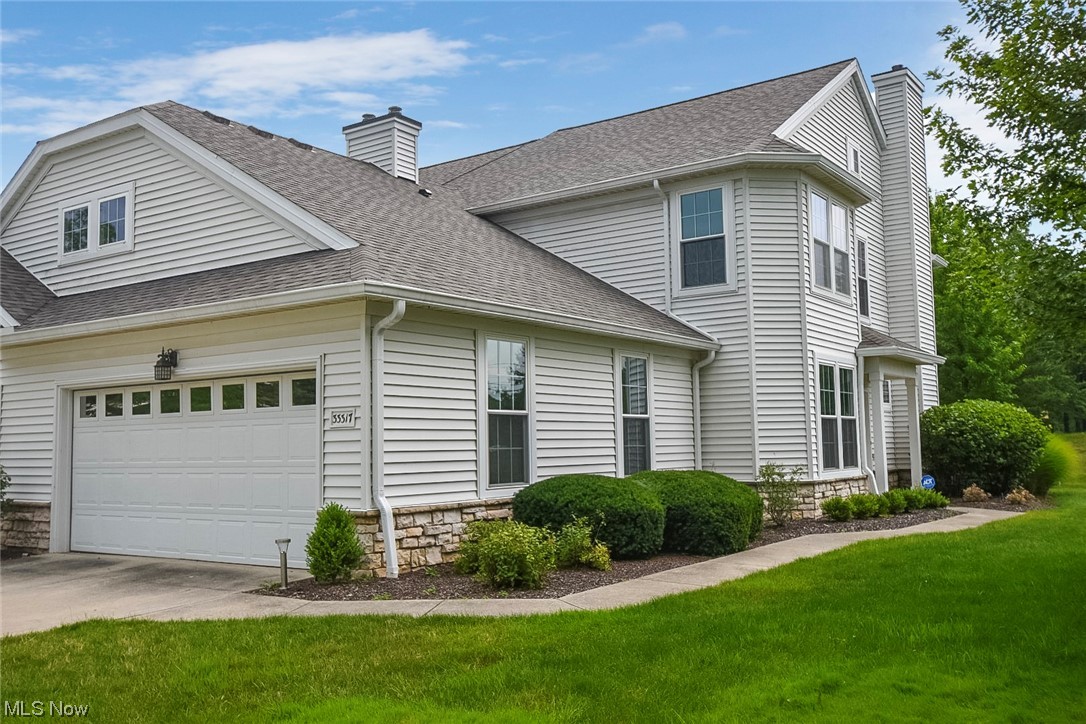 This private end unit condo in Waterside Crossings is a former model home with amazing features-Hardwood floors, a beautiful kitchen with appliances, mahogany cabinets, large pantry, laundry room - washer and dryer included! 9 foot ceilings throughout add to the luster of an already large home. Spacious living room with sliding glass door leading to the patio overlooking the community park. Features white built-in shelving and a large mantle mirror perfectly with the black marble enclosed fireplace. Beautiful 1st floor half bath with Italian basin. Generous bedrooms with large closets & big windows! Master suite with tray ceiling and panoramic views is a true owner's retreat. Features massive walk-in closet, bath with corner soaking tub and separate shower and over sized vanity with double sinks. Neutral paint (with modest accents) and carpet throughout. 2-car attached garage. Prestigious Avon Lake City School District. The fantastic community neighbors a 40 Acre Park. Residents of Wat