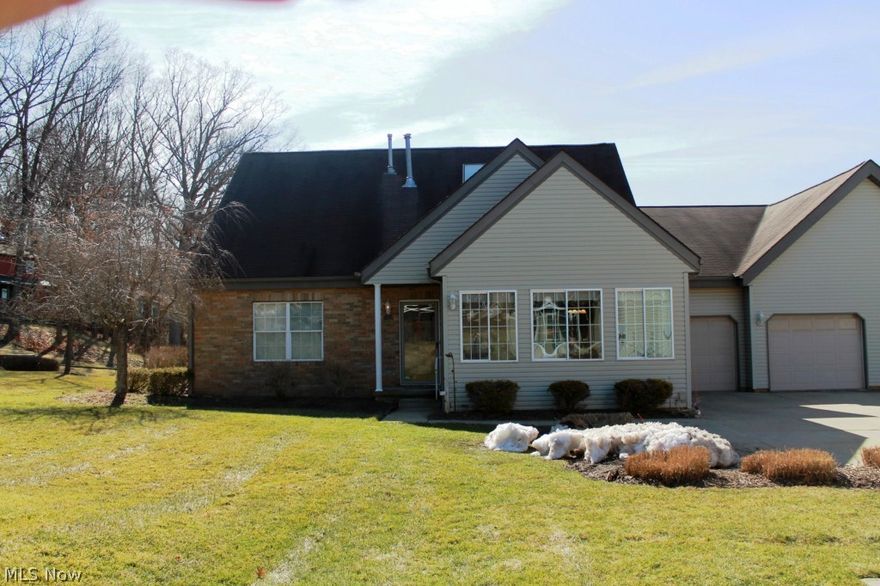 Beautiful condo in North Canton. This home has a large season room, fireplace, jetted tub,vaulted ceilings, laundry room, and a heated 2-car garage with tile floors and gorgeous cabinets.  Located on a No Outlet road that's only minutes from Canton Mall.