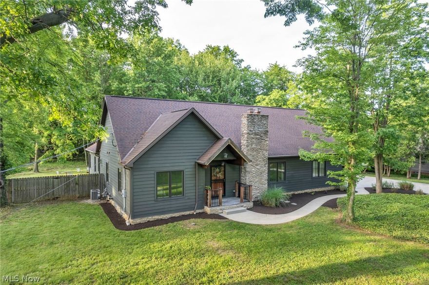 Discover your dream home right here, in the heart of Westlake! This expansive 2500+ sq foot ranch sits on a serene 1.3 acre double wide lot, offering both luxury and tranquility. Greeted with Mahogony wood flooring throughout you'll fall in love with the open living space featuring a gourmet kitchen with granite counters, a 9 ft island, walk in pantry, vaulted ceilings, ample cabinet space (cherry wood), stainless steel appliance and great windows providing a breath-taking view. The vaulted ceilings continue to the spacious en-suit where you'll enjoy a walk-in closet, expansive windows and luxurious private bath. The second full bath is tucked away by the "kids" bedrooms, which are both comfortable sizes with great closet space! The on-going basement is ready for anything- once used as the current owners living room there is a fireplace, work benches and oversized rec space! Step outside into the quaint backyard where you may see deer or bunnies, but hardly ever a neighbor! Enjoy weekends and evenings on the stone patio with a private view of nature! This home offers the best off all worlds; space, privacy and room for entertaining! Don't miss your chance to call 27460 Bassett Road home!