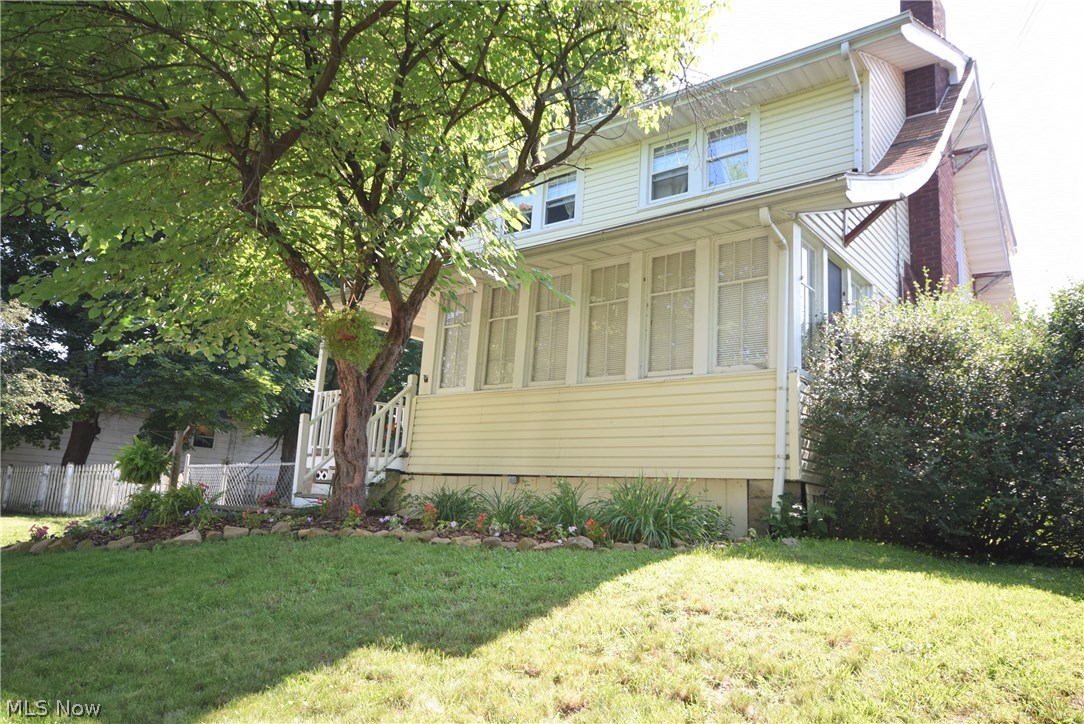 The front porch invites intrigue into this lovely three bedroom colonial located in Firestone Park. Plenty of windows, not only in the sun room but throughout this home, allow sunlight to enhance the wood features. The family room has hardwood floors and attractive built in cabinets on each side of its fireplace. The dining room also features hardwood floors and a fetching built-in wooden hutch. The eat-in kitchen offers a built-in dishwasher and plenty of whitewashed cabinets. The large bathroom presents a separate shower and an oversized whirlpool tub! The basement extends cozy finished rooms with carpeting. The bountifulness of this house continues outside the sliding glass door with a stone patio, a fully fenced yard, a separated gardening area and an above ground pool!