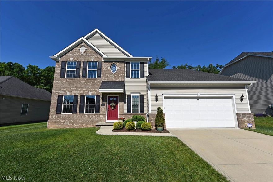 There is nothing basic about this beautiful custom home.  Large active families will love this one! The first floor was designed for family togetherness with the eat-in kitchen and great room. The kitchen features granite countertops, a beautiful ceramic backsplash and stainless appliances.  The view from the kitchen window will enchant!  An eating area opens to a beautiful Trex deck that will undoubtedly be the place where you relax in the evenings to watch wildlife put on a show in your own backyard. The property extends beyond the fence to the tree line at the back of the lot which abuts protected greenspace.  Off the great room the addition houses a bedroom for guests, teens or in-laws with its own en-suite. All the bedrooms are generously sized and feature abundant closet space.  But the basement! It goes on for days! Great storage, cozy family room with built-in shelving units, a full bathroom and yes, another bedroom with walk-in closet! Sculpted carpet, Trex decking, full grain