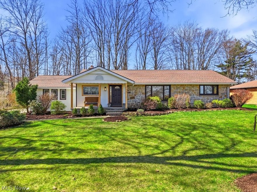 Welcome to this fully renovated, light-filled home where thoughtful design meets everyday functionality. Upon entry, you're greeted by an airy open-concept layout, warm wood tones, and refined finishes throughout. The heart of the home is a stunning chef's kitchen featuring custom white shaker cabinetry, elegant quartz countertops, a large island with seating, a 36 gas range, SS appliances and a built-in microwave. Designer lighting and a seamless flow into the living and dining areas create the perfect space for both entertaining and everyday living. The dining area is anchored by a WB stone fireplace adding warmth and character. Expansive windows provide natural light and offer peaceful views of the outdoors, while the open layout provides flexibility for a variety of lifestyles. The main level features a beautifully designed laundry/mudroom conveniently located off the garage, complete with custom cabinetry, quartz countertops and a utility sink, combining functionality with elevated design. A stylish powder room on the main floor adds both convenience and a touch of sophistication for guests. The fully finished LL expands the living space significantly, offering incredible versatility. It includes a spacious rec/FR, a cozy fourth bedroom with an egress window and large closet, a full bath, and additional flexible areas ideal for a home office, gym, den, or guest suite. A custom wet bar with a beverage fridge and open shelving makes this level perfect for entertaining. This exceptional property is located in a desirable neighborhood, offering a perfect blend of peace and convenience, with shopping, parks, and highway access just minutes away. Additional updates and features include a new HVAC system (furnace and A/C), newer water tank, updated electrical and plumbing, vinyl windows (partially new), and a new garage door, hard wired smoke/carbon detectors. Professionally remodeled with city permits, this home offers quality craftsmanship and peace of mind.