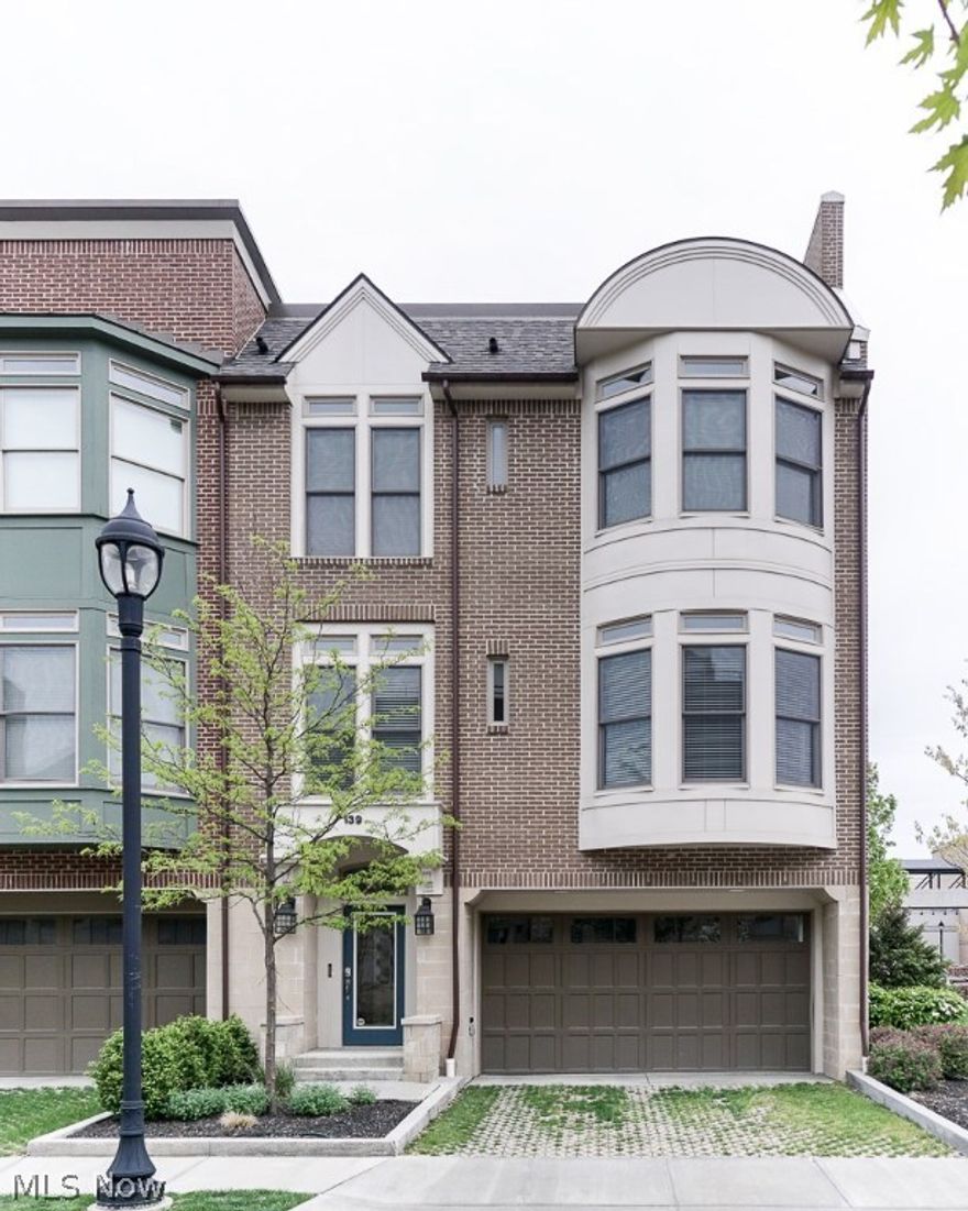 END UNIT 2-bedroom, 2 1/2 bath SOHO CITY LOFT CONDO inside CROCKER PARK, with EXTENSIVE UPGRADES. Fabulous tri-level open floor plan, with bay windows, wide plank hardwood flooring, custom blinds, marble fireplace, custom cabinetry in kitchen, SS appliances, built-in desk, stunning glass backsplash, and a raised granite breakfast bar. Master suite has a wall of windows and a deluxe on-suite bath with an oversized walk-in shower, marble seat, and an enormous skylight over the double vanity. Incredible roof top deck for outdoor entertaining. Security system, keyless entry, wall safe in master closet, full-size, front loading LG Washer and Dryer, and a 2-car attached garage with plenty of room for storage. Walk to shops, restaurants, cafes and the wine bar, right outside your front door. Close to I-90, downtown Cleveland, area medical centers, and the airport. WESTHAMPTON AT CROCKER PARK.....Homes with the BEST BACKYARD in town!