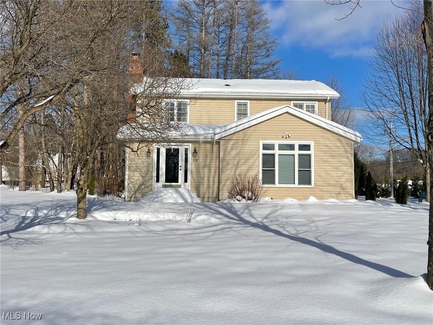 Charming home with many updates and superbly maintained nestled in the heart of Chagrin Falls. Inviting entry leads to cozy living room with cherry hardwood flooring and fireplace and opens to vaulted spacious great room with skylight and built-ins. Hardwood floors continue to dining room area that opens to the updated gourmet kitchen with stainless high-end appliances, custom cabinetry and granite counters ad includes a bar area with mini fridge and glass holders. Back hallway with spacious mudroom/laundry room with washer/dryer/utility tub and plenty of storage closets; powder room and access to the attached 3 car garage: heater added in 2020. 2nd floor features 3 spacious bedrooms and 2 updated bathrooms. Spacious primary suite includes glamour bath complete with jetted jacuzzi tub, shower, and 2 separate vanities w granite counters with plenty of storage cabinetry and large walk in closet. Two additional bedrooms and hall bath with tub/shower. Unfinished lower level with plenty of storage and extra bathroom. Other improvements: Whole house generator added in 2021. 2 hot water tanks (2017/2019); Furnace (2013) Roof over addition (2008) Roof main house (2012). Corner lot with spacious front back and side yards, concrete oversized driveway. Quiet dead end street minutes from downtown Chagrin Falls. Informed by Chagrin Falls that it was approved to add sidewalks from Hillside and Miles Road up to the Solon Road intersection - for a safe and easy walk into town! (completion expected by 2029). Make Hillside your home sweet home today!