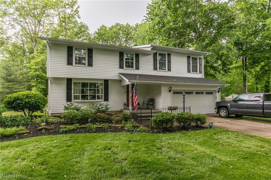 Come home to Avon! This home sits on a private 1 acre lot and summer is the perfect time of year for enjoying your concrete back patio with cookouts, family gatherings along with your bubbling hot tub/spa. The large deck is only one step up and accessible from the kitchen too. After dinner, move out to the large fire pit and listen to an Indians game over marshmallows and chocolate! The kids will enjoy playing in the basement when the weather changes and there is a study area/home office downstairs too. The newer washer and dryer stay with the home and for your convenience the wood burning FP has been converted to gas logs. When it's time to retire for the evening you can't beat the comfort of the huge owner's suite addition with cathedral ceilings, walk in closet and glamour bath with its granite countertop & step in shower. The classic look of hardwood floors in the other bedrooms never go out of style. This well maintained home features double ovens, beautiful stainless fridge and d