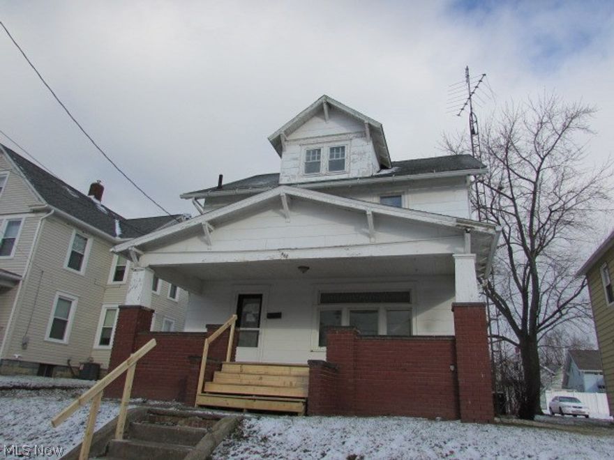 Nice Colonial style city home with front porch. Large kitchen and a formal dining room.  Finished attic. Good location, good value.  Property sold AS IS.