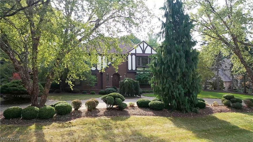 Fabulous English Tudor meticulously maintained on a private lot located in prestigious Winterberry Green. Over 6,000 sq ft of living space filled w high-end finishes throughout. This wonderful home features a restructured kitchen w Mullet cabinetry, commercial Viking appliances, granite countertops, working center island, & dinette area w delightful views. The family room has a fireplace w custom built-ins, & French door to the fabulous Great room. The fantastic 800 sq ft Great Room has soaring coffered ceilings, an additional custom fireplace, a loft area with custom rod iron railings, & access to the courtyard. A private first-floor library w built-in shelving, dining room, quaint and cozy sunroom, half bath, and laundry room complete the main floor living space. Two separate basements provide options for versatile functionality. A more casual space offers a finished recreation room & private full bath, while an additional finished lower level provides entertaining space w a top-of-t