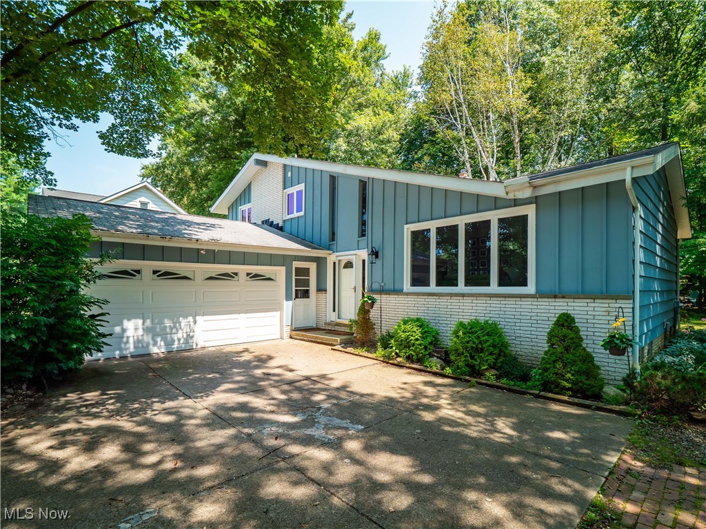 Welcome Home!! Come see this beautiful updated split-level home that offers both comfort and convenience. Featuring four well-appointed bedrooms and two full bathrooms one of which was just updated, this residence is perfect for both relaxation and entertaining with the fireplace in the family room. The interior boasts beautiful hardwood floors throughout the entire second floor along with the living room/dining room, adding a touch of elegance and warmth. An attached 2-car garage provides ample space for vehicles and storage, The back 2-car garage has recently been updated with all new drywall, has been insulated and has had heating and air conditioning also added to it! What a great space to have an office or anything your heart desires! This property stands out with its thoughtful layout and the care it has been given making it a truly inviting place to call home. Whether you're looking for space to grow or simply a peaceful retreat, this Solon home meets all your needs with style and functionality. Schedule your private viewing today.