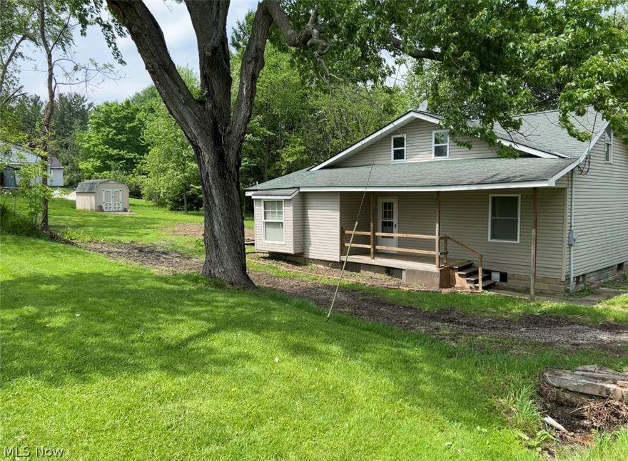 This is a cozy home located in a country like setting and on a private road. The lot is .48 acres with woods on south property line.  This home has recently been updated fresh paint, new carpeting.  On the exterior trees have been removed to create an open airy environment. New gutters and downspouts have been installed. The basement and crawl space houses the washer, dryer, hot water tank and furnace. the basement is typical for its age. There is a stairwell to an upper attic like area that could be remodeled for additional living space, an office or storage.  A great home for a buyer looking for a "property to live in and fix up". A detached double car garage with electric can be used as a workshop or storage for yard equipment. There is an additional shed at the rear of the property for storage. All appliances stay. Firelands school district, vacant and ready to move in