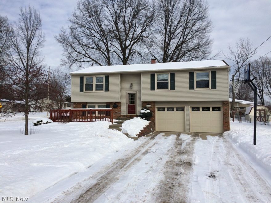 Not a thing to do to this 3 bedroom,2 1/2 bath raised ranch in great Austintown development. Gorgeous updated kitchen has GRANITE countertops & TRAVERTINE tile flooring. Dining area has "wood" laminate flooring. All appliances stay in kitchen & laundry room. Living room features newer (2010) carpeting. Master bedroom suite has updated bath with newly added tiled step-in shower. Partially finished basement has been completely updated & has convenient half bath. Other recent updates include new front porch & large rear deck that overlooks one of the largest yards in the neighborhood! New 16x12 shed. Newer siding, windows, & roof (approx 2009-10). Furnace less than 15 yrs. Ask your agent about possible $5000 Welcome Home Grant for downpayment!