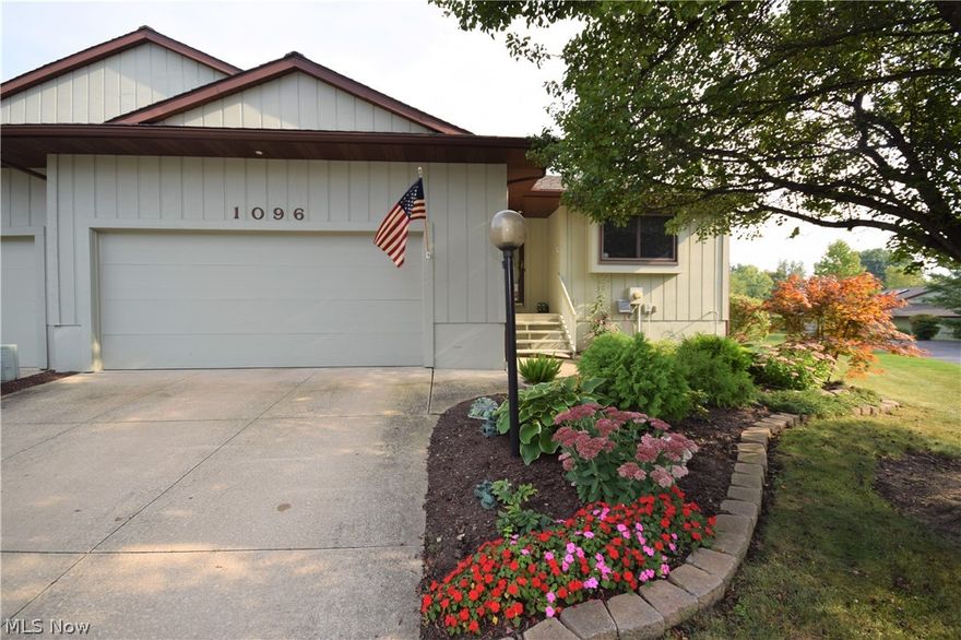 Welcome to 1096 Drummond Ct. in Stow! This spacious, 3-bedroom, 3-bathroom condo has numerous desirable features throughout. Huge eat-in kitchen with a tons of cabinet space featuring granite counters; you definitely won’t run out of prep or storage space! The kitchen also has beautiful updated hardwood flooring. Fridge and stove are both stainless steel. Kitchen sink overlooks the large living room, which has a brick fireplace and lots of windows, allowing the sun to illuminate the space. Off the living room is a bonus sun room that leads outside to the gorgeous wooden deck, overlooking the peaceful backyard. Large owners’ suite, complete with 2 walk-in closets and bathroom with double sinks. 2nd full bath upstairs has been updated with a walk-in shower. new toilet, hardwood floors and granite counter top.  Finished walk-out basement – a perfect place to entertain! Basement has a fireplace, full bathroom, access to a covered stone patio, and the 3rd bedroom with an egress window. This