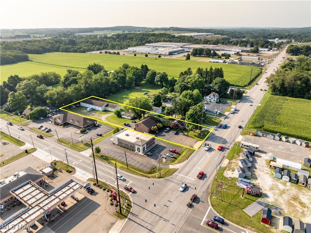 REAL ESTATE AUCTION - Thursday September 18th @ 2pm - All Brick Professional Office Building on 1 acre w/2 single family homes (long term tenants on MTM) and 9 large storage building w/9 units - all currently rented. Property is located on high traffic location on State Route 21 just south of intersection of 21/Navarre Rd. The Brick office building has 3 separate units. The large Upstairs unit has 6 offices, breakroom/kitchenette, restrooms, and nice large conference room. Lower level has two units that are currently occupied by small businesses. This property in its entirety currently cashflows for over 78k/yr! Don't miss this Prime Investment Opportunity for Owner/User!