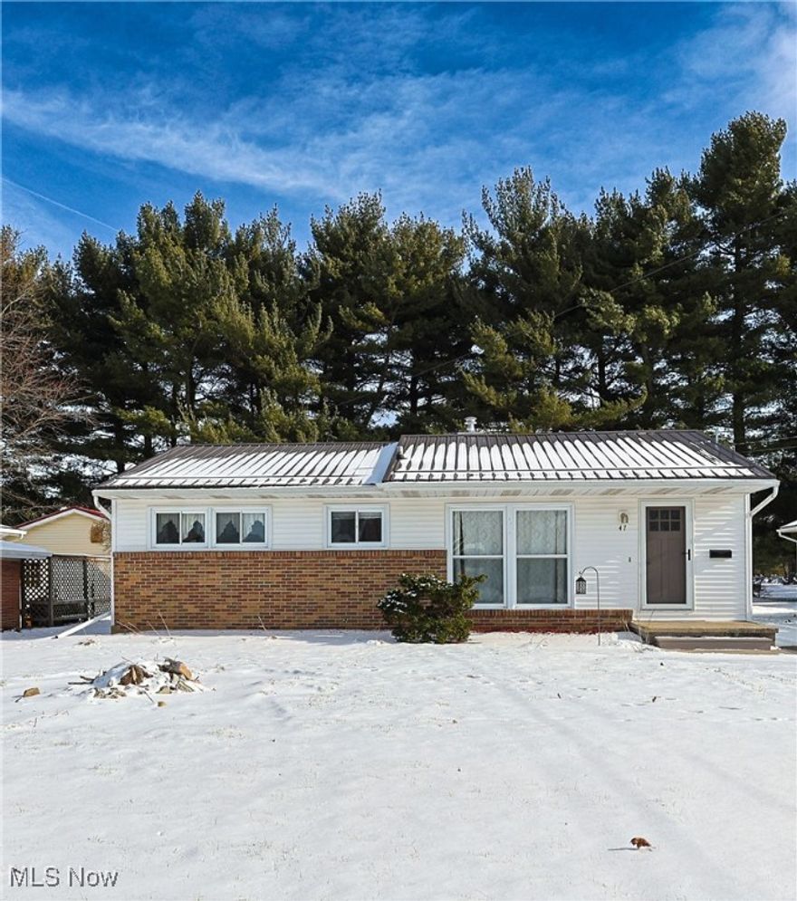 Charming 3 bedroom, 1 bathroom ranch with a heated, deep 1-car detached garage, nice-sized yard, and storage shed. Big living room windows flood the space with natural light, and the eat-in kitchen sits just steps away, making everyday living easy and comfortable. Original hardwood floors in the bedrooms and built-ins throughout the home add warmth and character you don't often find at this price point. The updated bathroom is a great bonus, and one bedroom has been previously converted to a main-floor laundry room but could easily be changed back to a bedroom if desired. A full basement offers plenty of additional storage or hobby space, and major updates include a new metal roof installed this year and a hot water heater in 2023, giving peace of mind on big-ticket items. Enjoy the nice covered back porch that connects the house to the garage, creating a convenient and sheltered transition between indoor and outdoor spaces.