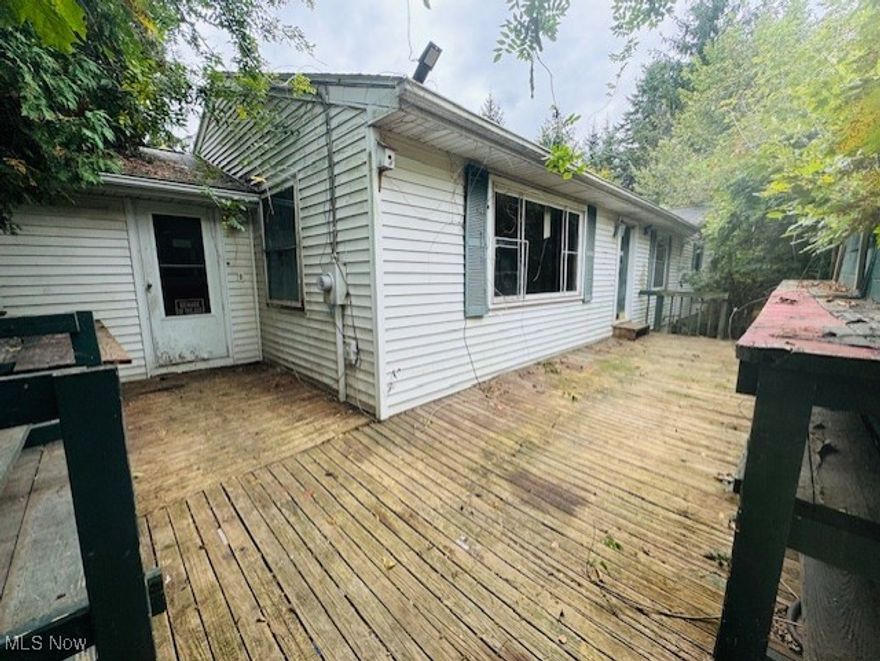 Investor Special in Rootstown School District! This spacious ranch home offers 1,512 sq. ft. on both the main floor and full basement, providing a total of over 3,000 sq. ft. of potential living space. Perfect for someone with vision, this property is in need of updates and a fresh perspective to bring it back to its full potential. The home sits on a generous 1.15 acre lot and is in close proximity to State Rt. 44 & 43, shopping, dining & Northeast Ohio Medical University. The layout provides ample space for customization and ready for modern updates. This is an excellent opportunity to create your dream home or invest in a high-potential property. Septic was replaced in the last five years. Detached garage in the process of removal- 1+ car attached with entrance to the lower level. Don’t miss out on this blank canvas waiting for your personal touch! Sold "AS-IS".