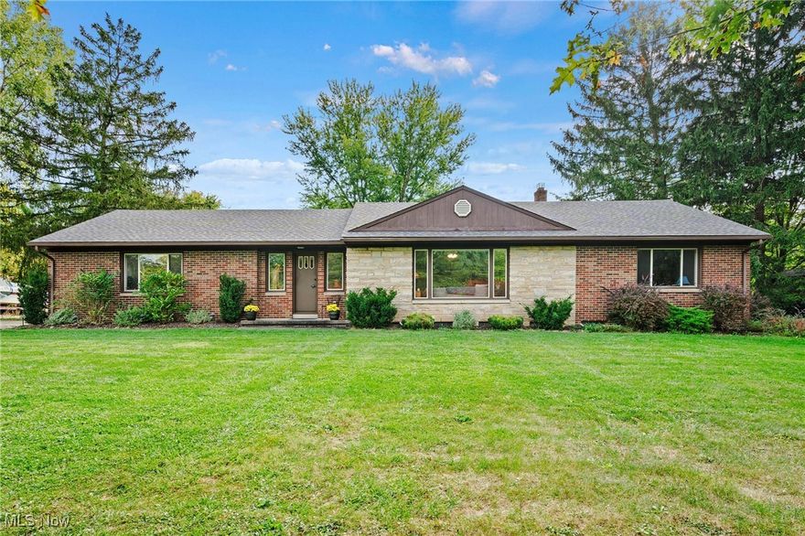 Discover serene living at 2897 Northampton Road in Cuyahoga Falls, where modern comfort meets natural beauty. Situated on a full acre this home is just minutes from Blossom Music Center, Cuyahoga Falls Market District, Cinemark Theater, the many restaurants of Merriman Valley and Cuyahoga Valley National Park.

This meticulously maintained property offers the perfect blend of privacy and accessibility. The lighted sandstone patio is perfect for seamless indoor-outdoor entertaining from spring through fall. Experience the seasons changing in the large native wetland/rain garden through the native plants, wildflowers and pollinators. Whether hosting gatherings or simply unwinding in the hot tub, you'll love the tranquil setting that complements Northeast Ohio's beautiful seasons.

Inside, two spacious bedrooms on the main level are accompanied by a tastefully renovated bathroom. The bright, airy living room is ideal for relaxing, while the updated kitchen boasts a recently added live edge black walnut bar, perfect for casual dinging or socializing. The basement offers a full bathroom, an additional living space, and a versatile flex room that can serve as a third bedroom, and ample storage space. 

With numerous updates in the last five years, including a new roof (2019), insulation (2019), half bath (2022), sump pump (2020), full sanitary line connection replacement (2020) and new Crown boiler (2020), you can move in with confidence and peace of mind.