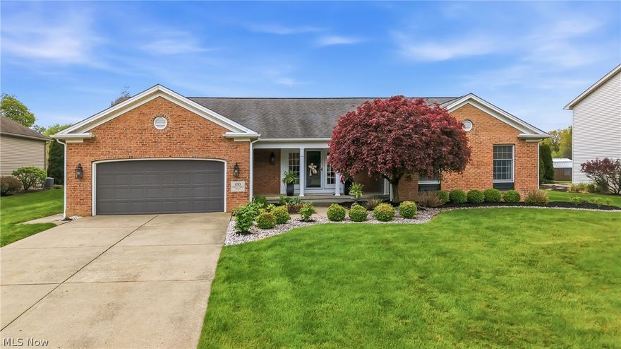 100 Forest Hill Dr, Hubbard, Ohio 44425. Nestled on a quiet cul de sac in the Hubbard School District, this beautifully maintained home offers exceptional curb appeal, quality updates, and a private backyard oasis perfect for entertaining and everyday living. The welcoming front porch leads to double entry doors opening into a spacious foyer with tile flooring and two large coat closets. The impressive living room features soaring vaulted ceilings, hardwood flooring, a fireplace, and an open inviting feel ideal for gatherings and relaxation. The custom kitchen is truly the heart of the home offering white soft close cabinetry, quartzite countertops, tile backsplash, stainless appliances, custom lighting, and a stunning shiplap vaulted ceiling. Butler style cabinetry with built in shelving and upper glass cabinets provides additional storage and character. Just off the kitchen is a gorgeous four seasons room with hardwood flooring, shiplap ceiling, walls of windows, and peaceful views of the private backyard making it the perfect sitting area or dining space filled with natural light. Convenience continues with first floor laundry, a half bathroom, and access to the attached 2 car garage. The opposite side of the home hosts 3 spacious bedrooms including a private primary suite with abundant closet space and a full bathroom featuring a walk in shower, vanity, and tile flooring. The finished basement provides outstanding additional living space including a large family room, potential 4th bedroom or office area, hobby room with built in cabinetry, tons of storage, and access to two finished crawl spaces. 200 amp panel, high efficiency furnace/AC, and sump pump. Step outside to your own backyard retreat featuring composite decking leading to a stone patio with pergola and stone pillars, a custom built in grill with stone countertops, half court basketball court, and beautifully landscaped privacy with mature bushes and plantings. A wonderful place to call HOME!
