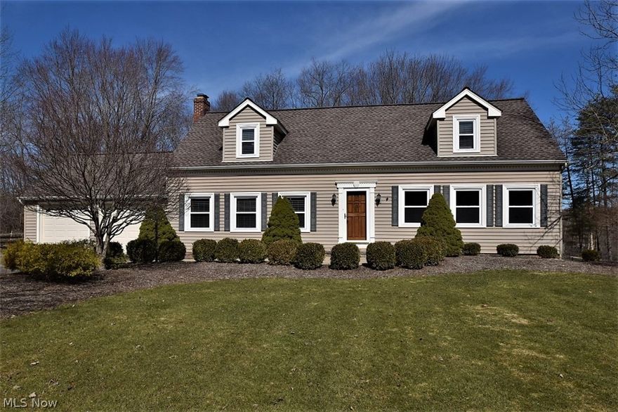 Beautiful, updated colonial with a great sprawling floor plan. The kitchen is open to the family room with hardwood floors, granite counters, stainless appliances, a double wall oven, countertop cooktop, custom cabinetry, an island with seating, one of the four fireplaces and sliding doors to the backyard. A large deck overlooks a the private backyard with wooded & lake views. Hardwood floors continue into the large dining room and inset sliding wood paneled doors separate the dining room and great room if you prefer. The great room not only has a wet bar area with space for a game table, but opens to another family room with a fireplace flanked by built-in cabinets and door to the deck. The laundry room has a full bath and is off the kitchen hallway leading to the great room. The master bedroom also has a fireplace, a beautiful updated bath features granite counters, tile shower/ flooring and a great walk in closet. One of the other bedrooms has the 4th fireplace! The hall full bath f