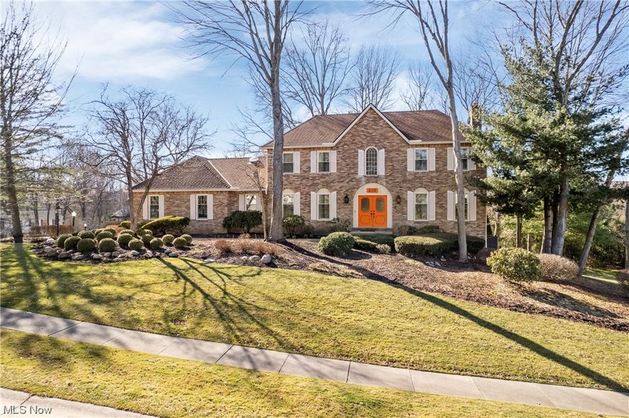 Welcome to your dream home nestled in the coveted Lake of the Woods neighborhood in West Akron! This stunning brick exterior home boasts exquisite landscaping and sits on a corner cul-de-sac wooded lot, offering both privacy and charm. Spanning over 2930 square feet, with an additional 600 square feet of living space in the huge finished basement, this residence offers ample room for your family to thrive. The first floor features convenient amenities such as a laundry room and a spacious kitchen equipped with double ovens and granite countertops. The kitchen seamlessly flows into a cozy breakfast nook and a family room adorned with a large bay window, exposed beams, built-in bookcases, a wet bar, and a gas fireplace. Enjoy the beauty of nature year-round in the vaulted sunroom, complete with French doors leading to a spacious deck overlooking lush landscaping and gardens. With wall-to-wall windows, doors, and skylights, the sunroom is bathed in natural light. Entertain guests in the formal dining room, unwind in the additional living room, and stay productive in the dedicated office featuring a built-in desk and shelving. Upstairs, the primary bedroom suite awaits, boasting a large bedroom and a bathroom with double sinks, a soaker tub, a separate shower, and a nicely appointed walk-in closet. Two additional nicely-appointed bedrooms share a second full bathroom. The basement offers a remarkable 20' x 10' cedar closet, perfect for storing your seasonal belongings. There is also lots of additional living space on the lower level, perfect for a playroom, bedroom, or rec room. Recent updates include HVAC (2020), hot water tank (2020), windows (2018), garbage disposal (2021). Custom storage solutions are found throughout the home, ensuring every inch is utilized efficiently. Conveniently located near Summit Mall and within the esteemed Copley-Fairlawn Local Schools. Bonus features include a lawn sprinkler system, garage workshop, and extra storage above the garage.