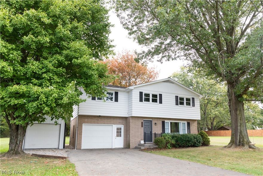 Comfortable and stylish with numerous updates, this rare 4 bedroom home sits on a flat, usable half acre lot in a gorgeous neighborhood. With mature trees flanking the back yard and a large front yard, it feels like country living but just a few minutes from the quaint town of Louisville. The home has been completely updated from the roof to the basement. It is truly move in ready with ALL appliances including the washer and dryer. The master includes a walk in closet with custom shelving and a full master bath. Enjoy fall evenings on the new deck overlooking the backyard. A 26x12 additional garage has been recently added with a cement floor. Move right in and simply enjoy super low maintenance for many years to come!
