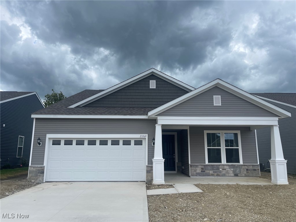 Quick Move In Ranch Home with front porch and a backyard with a wooded view. Offering 2 spacious bedrooms, 1 Office/Flex Room and 2 full baths. An open-concept layout features a beautiful traditional fireplace in the gathering room. Stainless steel appliances, 42" white tall cabinets with soft-close doors and drawers, and sleek quartz countertops that continue into both full baths. Luxury vinyl plank flooring flows through the main living areas. Back covered patio to enjoy the sunny days under some shade. Additional highlights include a low-maintenance lifestyle with lawn care and snow removal included.