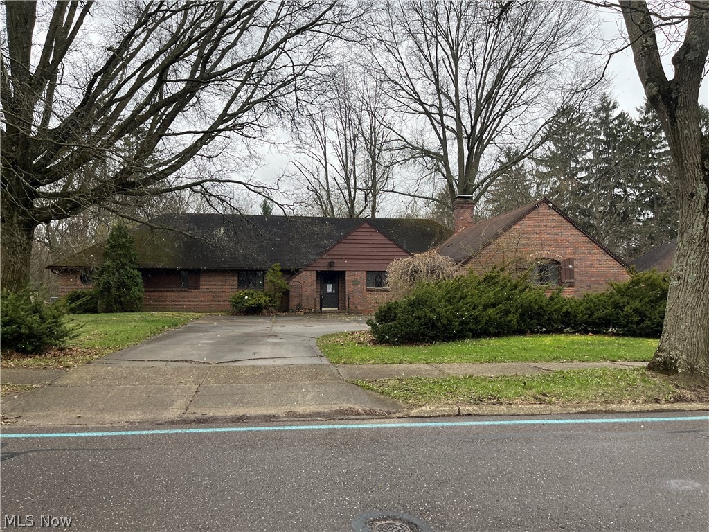 This amazing, sprawling brick ranch sits on a .31 acre lot in Northwest Akron, across from Stan Hywet Hall & Gardens and only minutes from the Cuyahoga Valley National Park and Akron Metro Parks. Inside you will find a thoughtful floor plan including an Owner's Suite with walk-in closet, full bath, and private entrance. The property also features an enclosed porch, private patio and large bonus room with a fireplace. Property sold As-Is. Equal housing opportunity.