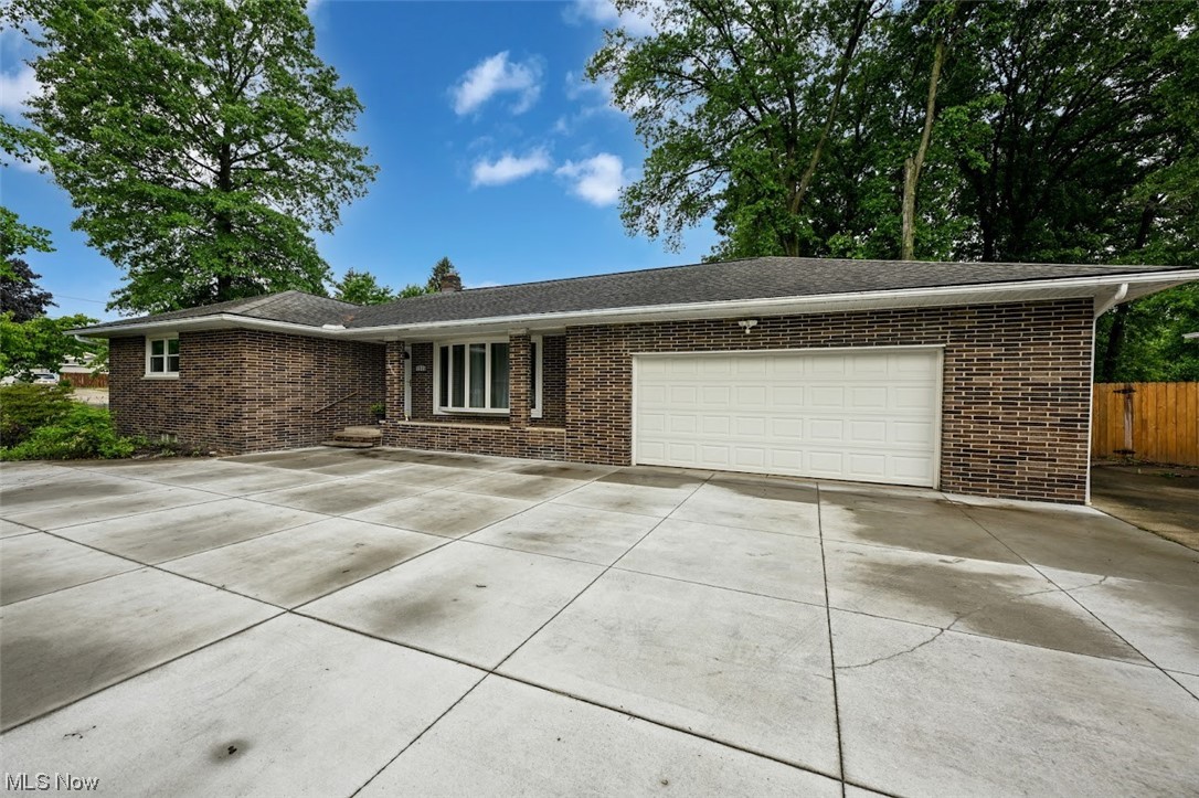 Welcome home to this brick ranch home with 3 spacious bedrooms, 2 full bathrooms,2 Full Laundry rooms basement and first floor, updated kitchen, wood flooring and partially finished basement! The outdoor space here is amazing! Enjoy a heated pool with deck, fully fenced yard, huge patio and shed! This yard is perfect for your summertime entertaining or relaxing! The 2 car attached garage plus a 26x26 detached shop building with electric and water, is just waiting for those hobbies and car collectors! Plenty of parking too with a horse shoe concrete driveway! Newer Roof, Windows, Well pump, Newer Septic System, Newer garage door opener, New Whole House water softner system, All New Stainless Steel Appliances. There is so much to offer here and conveniently located too! Near shopping, dining, schools and parks! Just move in and enjoy! Don't wait....schedule those showings today!
