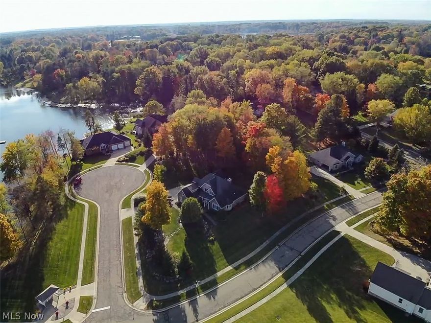 Absolutely beautiful & extremely comfortable home w/ all the Custom Builder Upgrades & Features with almost 3,500sf Living across from private Lake Royale & fishing pond to kayak, canoe, fish & swim! Tall ceilings w/ Open Floor Plan, 1st Flr Master Bdrm, 4 Bdrms & 4 Baths, 2 Direct Vent Fireplaces (Grt Rm & Mstr Bdrm), Dining Rm, Sunrm, 2-story Great Rm & Foyer w/ Open Walkway & Loft, all Granite & Quartz Countertops, Huge 4' x 8' Kitchen Island, 2nd Prep sink w/ disposal, SS GE Profile Appliances, real wood floors, Porcelain tile & high-end carpet! Professional closet organizers thru out & garage organizers, sound system thru out main rooms, Mstr, garage & exterior stamped concrete patio, ceiling fans in all Bdrms, Sunrm & Grt Rm; Laundry Room off Kitchen, 2nd floor huge suite w/ 2 closets & attached bathroom. Large Sitting Front Porch w/ stone, Gorgeous Professional Landscaping w/ granite & stone features, Stamped Concrete Rear Patio, 3-car garage w/ tons of lighting, insulated, heat